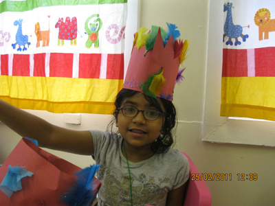 Pre-school aged girl with a handmade crown at Early Learners' Nursery School, Leicester
